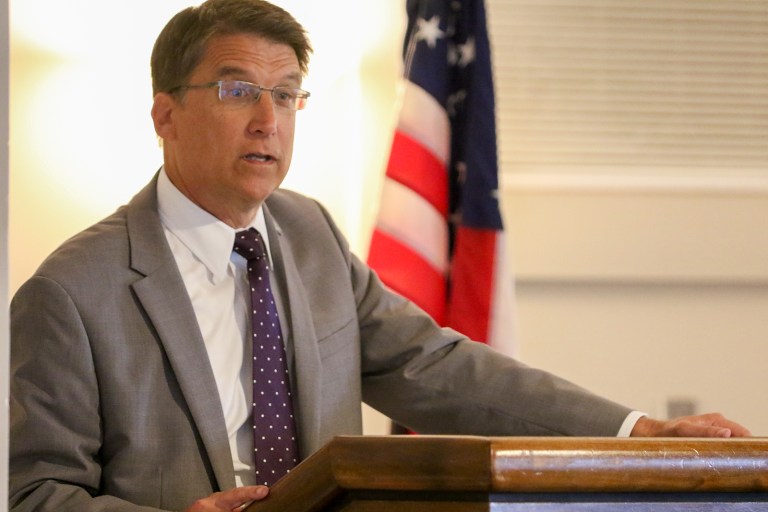 A group of protestors, sponsored by the state teachers' union, walked 23 miles from Durham to the state capitol, hoping to meet with North Carolina Gov. Pat McCrory. (John Althouse/The Daily News via AP)
