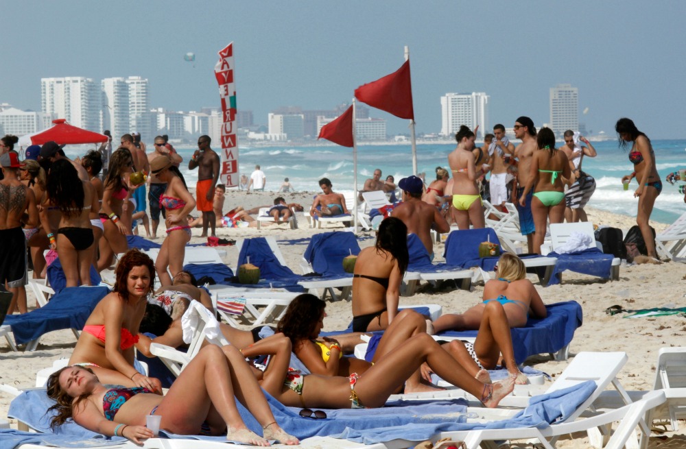 ‘This virus ain’t that serious’: Spring breakers defy government recommendations and shutdowns by heading to the beach