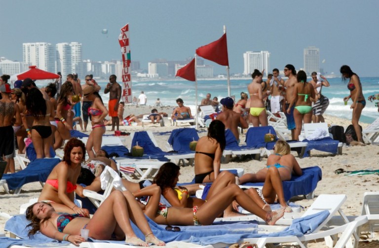 People travel to popular Spring Break destinations such as Mexico and Puerto Rico. (AP Photo)