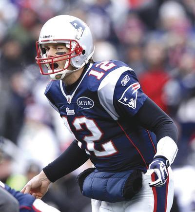 Elsa/Getty Images
Patriots quarterback Tom Brady wasn't pleased with his performance against the Ravens, throwing for 239 yards with two interceptions.