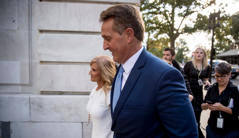 Sen. Jeff Flake, R-Ariz., accompanied by his wife Cheryl, leaves the Capitol in Washington, Tuesday, Oct. 24, 2017, after announcing he won't seek re-election in 2018. (AP Photo/Andrew Harnik)