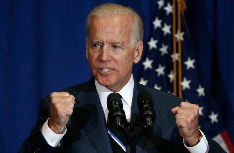 In recent polls, Biden takes third place at 12.8 percent, behind Hillary Clinton at 55.4 percent and Bernie Sanders at 19.7 percent.Â (Photo by Win McNamee/Getty Images)