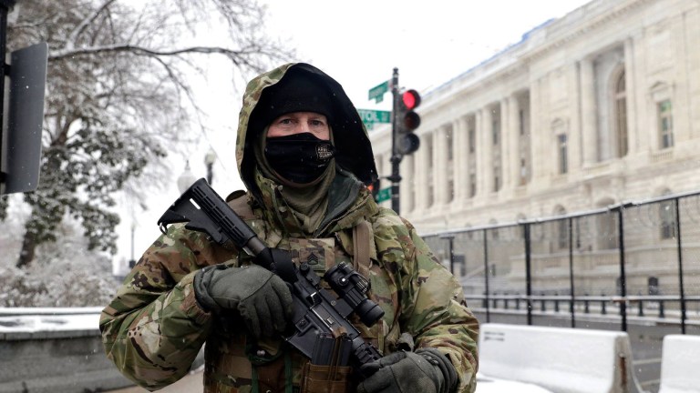 A member of the National Guard helps protect the U.S. Capitol during snowy winter conditions Jan. 31, 2021.