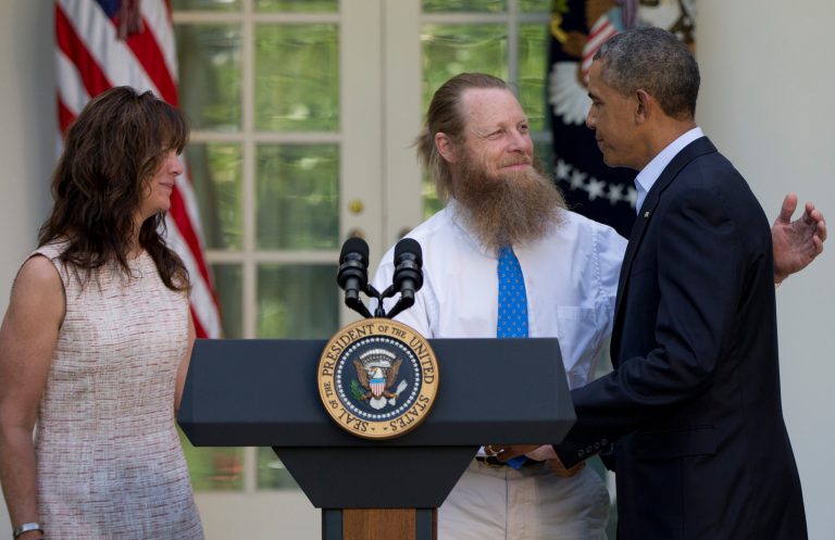 President Barack Obama shakes hands with Bob Bergdahl, as Jani Bergdahl stands at left, during a news conference in the Rose Garden of the White House in Washington, Saturday, May 31, 2014 about the release of their son, U.S. Army Sgt. Bowe Bergdahl, from captivity. (AP Photo/Carolyn Kaster)