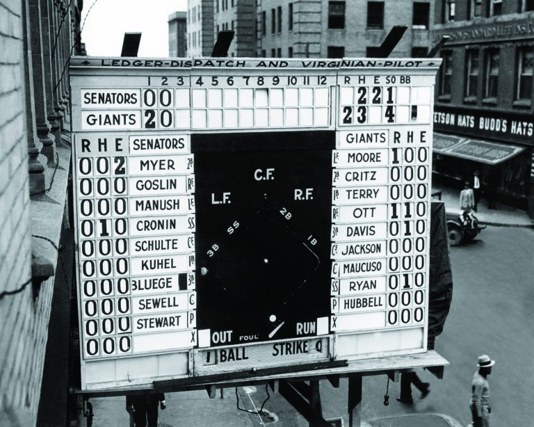 n this Oct. 3, 1933, file photo, a scoreboard showing Game 1 of baseball's World Series between the Washington Senators and New York Gians is displayed outside a building in Norfolk, Va. In clinching a playoff spot, the Nationals put the nation's capital in baseball's postseason for the first time in nearly 80 years. (AP photo)