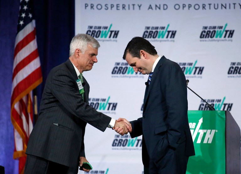 Sen. Ted Cruz, right, shakes hands with David McIntosh, president of the Club for Growth, after speaking at the group's winter economic conference Friday, Feb. 27, 2015. The Club for Growth PAC announced late Tuesday it will endorse Ted Cruz for president. (AP Photo/Joe Skipper)