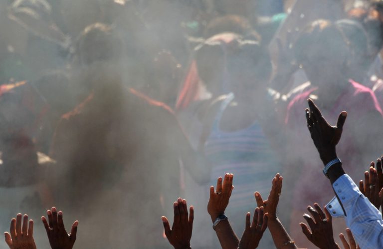   People raise their hands during a ceremony by Mayan sages in Bacuranao, Cuba, Thursday, Dec. 6, 2012. Three Guatemalan sages burned wood resin, seeds, fruits and flowers on a beach outside Havana on Thursday in a ceremony marking the end of a Mayan calendar cycle that some have wrongly interpreted as a prediction of a looming apocalypse. The ceremony in Bacuranao took place two weeks before Dec. 21, 2012, when a more than 5,000-year period of the Mayan calendar ends. (AP Photo/Ramon Espinosa)  