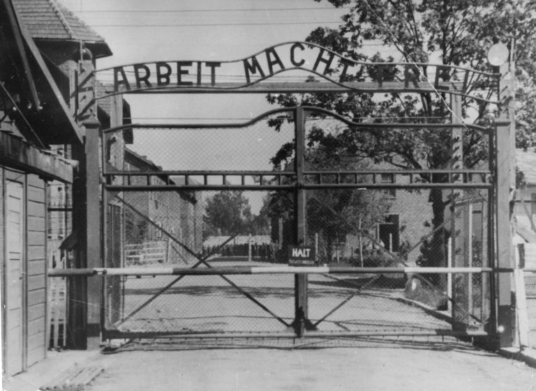 FILE - Undated file image shows the main gate of the Nazi concentration camp Auschwitz I, Poland, which was liberated by the Russians, January 1945. Writing over the gate reads: "Arbeit macht frei" (Work makes free - or work liberates). Johann Breyer, 89 faces possible extradition. A German court has charged him with aiding in the killing of 216,000 Jewish men, women and children during World War II. Breyer was arrested Tuesday outside his home in northeast Philadelphia. He has lived in the U.S. since 1952. Breyer has admitted he was an SS guard at Auschwitz in occupied Poland.