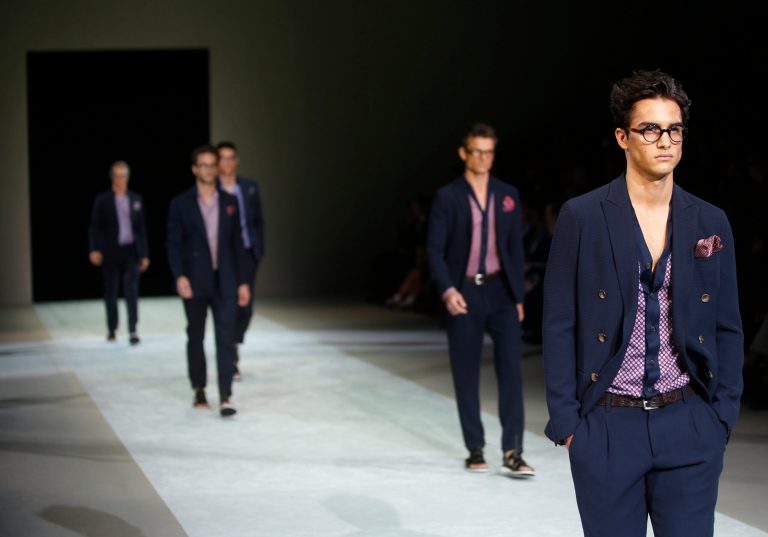 Models wear creations for Giorgio Armani men's Spring-Summer 2015 collection, part of the Milan Fashion Week, unveiled in Milan, Italy, Tuesday, June 24, 2014. (AP Photo/Luca Bruno)