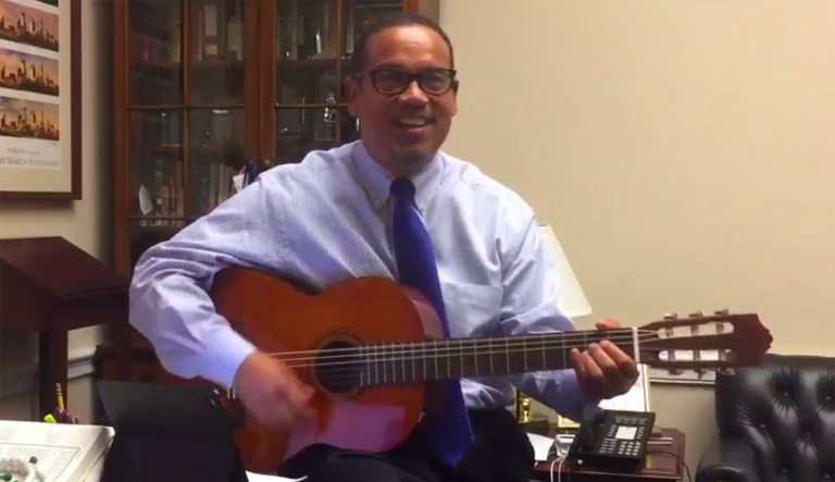 Rep. Keith Ellison, D-Minn., couldn't contain his excitement Friday after the Minneapolis City Council approved a $15 minimum wage and broke out in song. (AP Photo/J. Scott Applewhite)