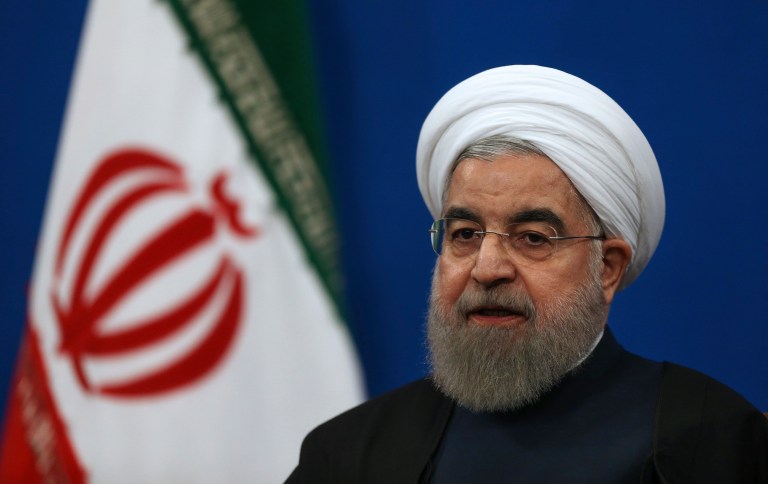 Iran will issue a retaliatory ban on issuing visas to Americans in response to President Trump's decision to suspend visas for Iranian nationals and travelers from other countries with a terrorist presence. Above, Iranian President Hassan Rouhani. (AP Photo/Vahid Salemi)