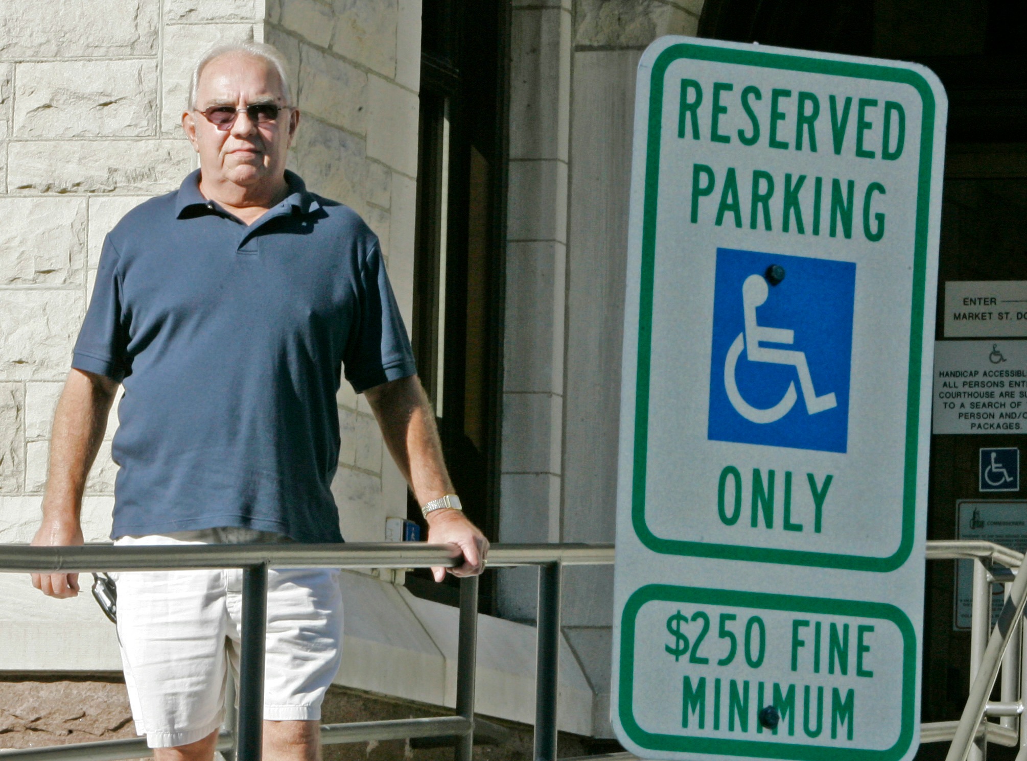Handicapped parking sign too low? See you in court!