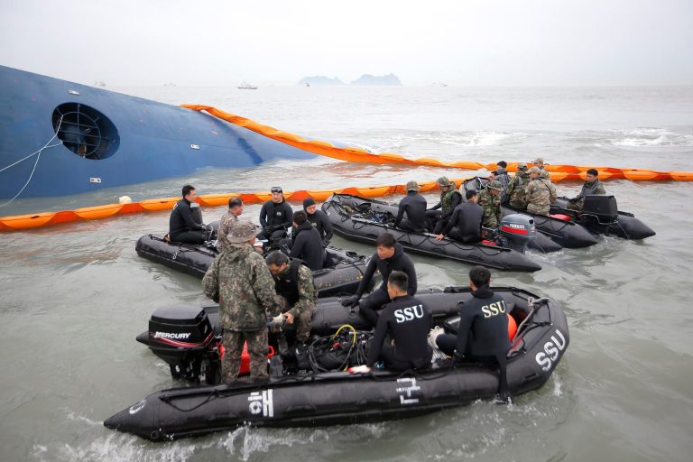 South Korean rescue team members prepare to search for passengers of a ferry sinking off South Korea's southern coast, in the water off the southern coast near Jindo, south of Seoul, South Korea, Thursday, April 17, 2014. Fears rose Thursday for the fate of more than 280 passengers still missing more than 24 hours after their ferry flipped onto its side and filled with water off the southern coast of South Korea. (AP Photo/Yonhap) KOREA OUT