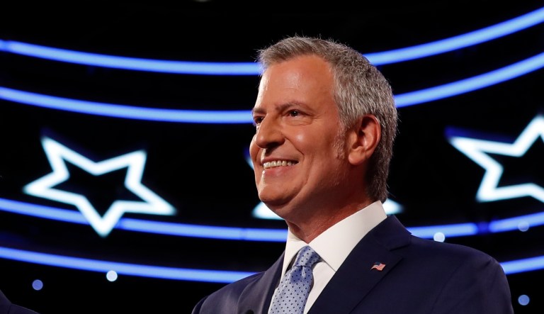 From left, Andrew Yang, Rep. Tulsi Gabbard, D-Hawaii, Washington Gov. Jay Inslee and New York City Mayor Bill de Blasio are introduced before the second of two Democratic presidential primary debates hosted by CNN Wednesday, July 31, 2019, in the Fox Theatre in Detroit.