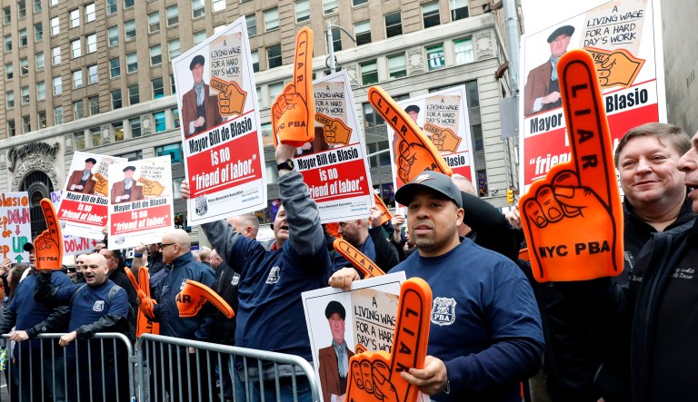 Members of the New York City Police Benevolent Association demonstrate outside "Good Morning America" as New York Mayor Bill de Blasio and his wife Chirlane McCray appear on the show, in New York, Thursday, May 16, 2019.