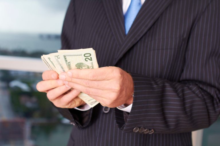 The rule would require companies to disclose the ratio between the CEO's annual pay and their employees'. (iStock Photo)