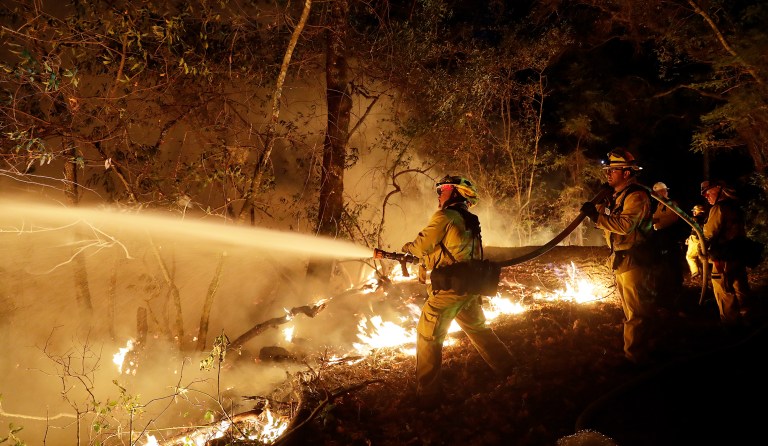 Fire crews battle a wildfire Saturday, Oct. 14, 2017, in Santa Rosa, Calif. (AP Photo/Marcio Jose Sanchez)