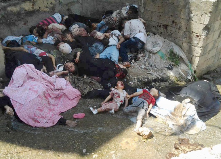 This citizen journalism image provided by Edlib News Network, ENN, and released on Saturday, May 4, 2013, which has been authenticated based on its contents and other AP reporting, shows dead bodies in Banias, Syria. Thousands of Sunni Muslims fled a Syrian coastal town Saturday, a day after reports circulated that dozens of people, including children, had been killed by pro-government gunmen in the area, activists said. (AP Photo/Edlib News Network ENN)