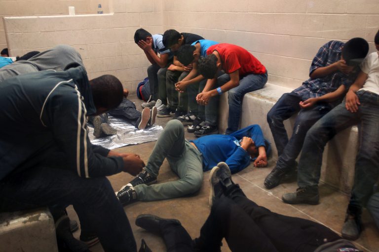 Immigrants who have been caught crossing the border illegally are housed inside the McAllen Border Patrol Station in McAllen, Texas where they are processed. (AP Photo/Los Angeles Times, Rick Loomis, Pool)