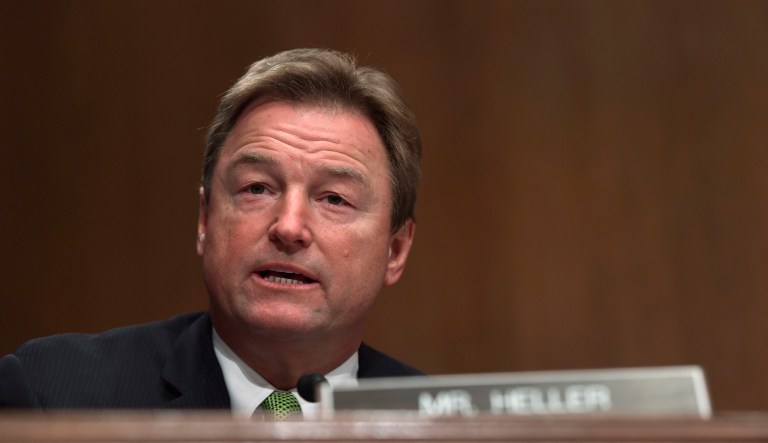FILE - In this Jan. 30, 2018, file photo, Sen. Dean Heller, R-Nev., asks a question during a Senate Banking Committee hearing on Capitol Hill in Washington. Heller, considered the most vulnerable GOP senator seeking another term this year, opposed measures to dismantle President Barack Obama's signature law before backing other versions that failed.