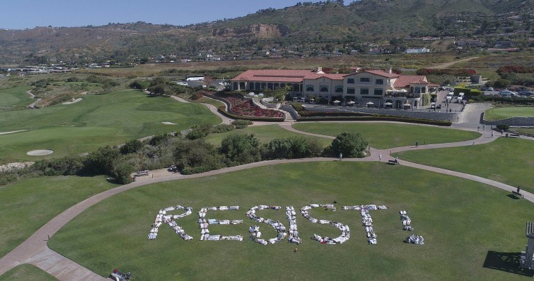 This Saturday, May 13, 2017, photo released by an organization known as Indivisible San Pedro shows protesters spelling out the word 