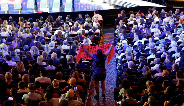 A protester yells during the second of two Democratic presidential primary debates hosted by CNN Wednesday, July 31, 2019, in the Fox Theatre in Detroit.
