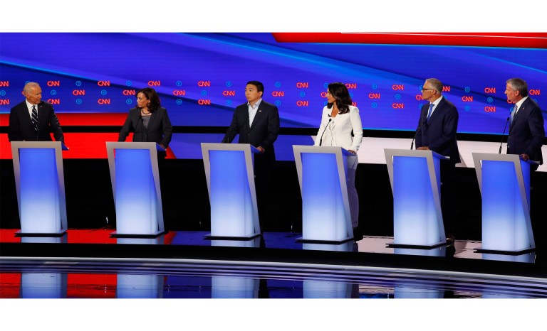 From left, former Vice President Joe Biden Sen. Kamala Harris, D-Calif., Andrew Yang, Rep. Tulsi Gabbard, D-Hawaii, Washington Gov. Jay Inslee and New York City Mayor Bill de Blasio participate in the second of two Democratic presidential primary debates hosted by CNN Wednesday, July 31, 2019, in the Fox Theatre in Detroit.