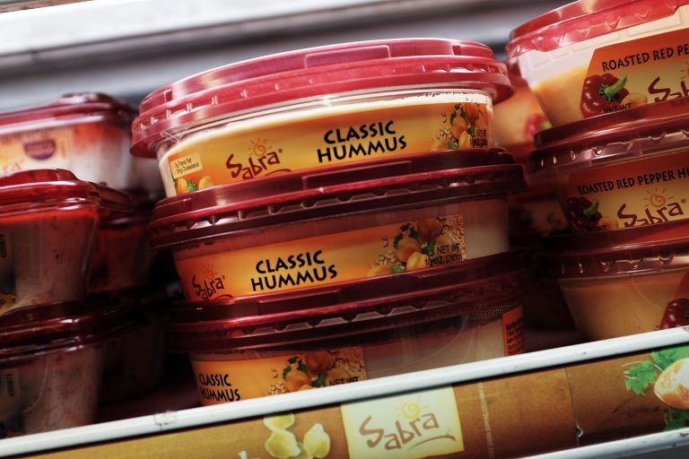 Cases of Sabra Classic Hummus are viewed on the shelf of a grocery store on April 9, 2015 in New York City. (Photo by Spencer Platt/Getty Images)