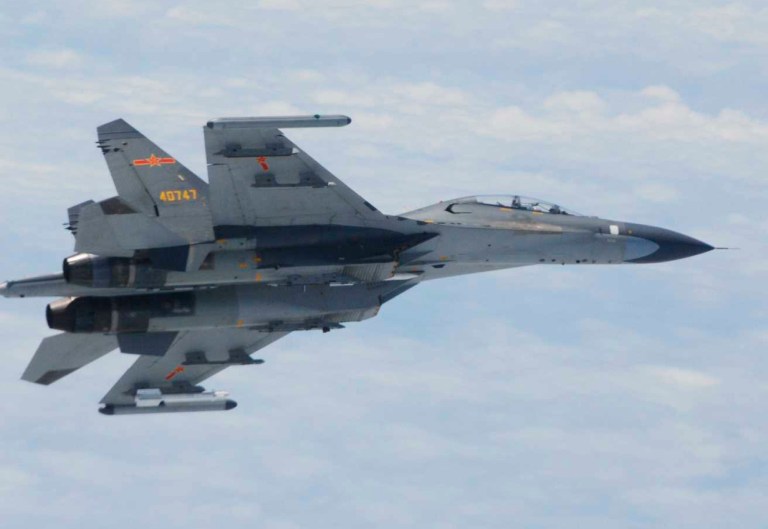 In this undated photo released by Japan Ministry of Defense, Chinese SU-27 fighter plane is shown. China and Japan are blaming each other for a close encounter between military jets over the East China Sea. China's defense ministry says Japanese F-15 fighters followed a Chinese TU-154 plane on regular patrol Wednesday, June 11, 2014 and got as close as 30 meters (100 feet). Japanese Defense Minister Itsunori Onodera said Wednesday that two Chinese SU-27 fighters had posed a danger to Japanese aircraft by flying near them. (AP Photo/Japan Ministry of Defense)