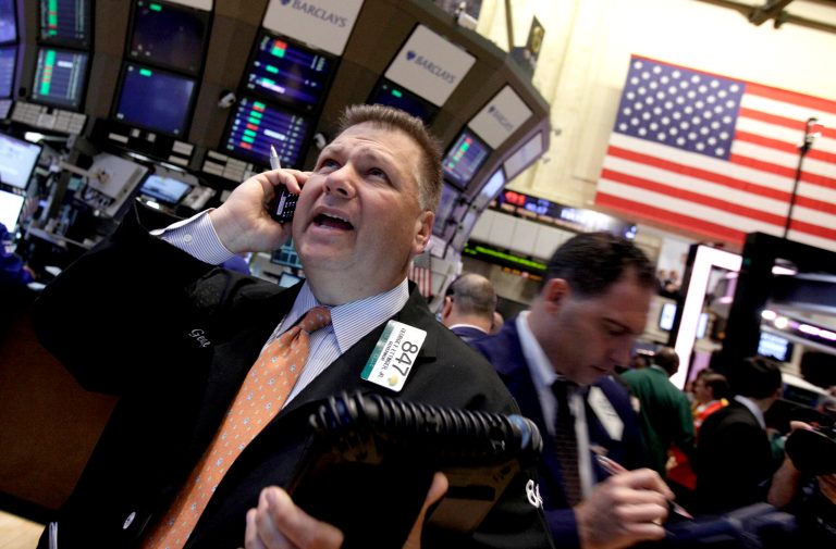   Trader George Ettinger, left, works on the floor of the New York Stock Exchange Monday, June 11, 2012. Stocks are opening higher on Wall Street, following markets higher across the globe after European countries said they would lend Spain as much as $125 billion to save its banks. (AP Photo/Richard Drew)  
