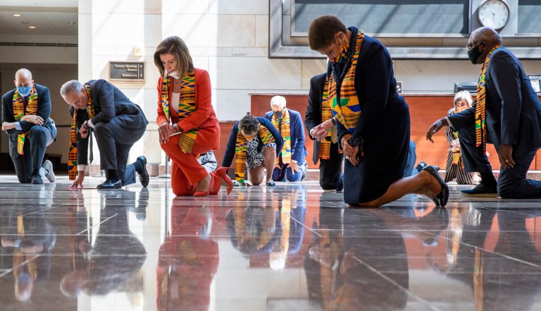 House Speaker Nancy Pelosi of California and other members of Congress gather at the Emancipation Hall, kneel, and observe a moment of silence to honor George Floyd and victims of racial injustice, Monday, June 8, 2020, in Washington.                                                                                                                                                   