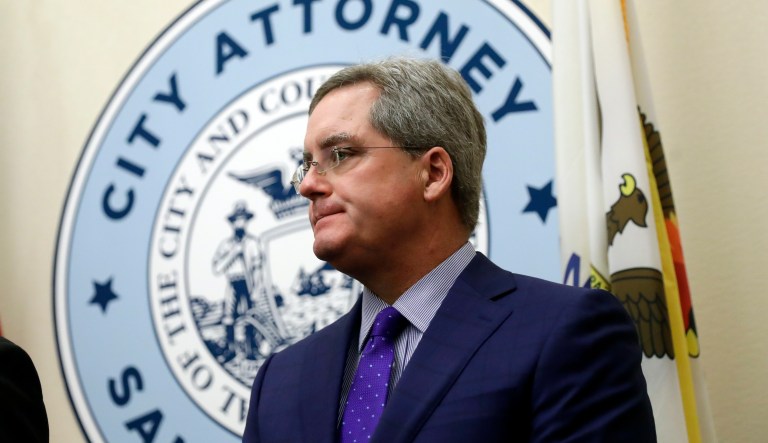In this Aug. 14, 2017, file photo, San Francisco City Attorney Dennis Herrera listens to questions during a press conference at City Hall in San Francisco. The city of San Francisco took a dramatic step Wednesday, Feb. 3, 2021, in its effort to get children back into public school classrooms, suing its own school district to try to force open the doors amid the coronavirus pandemic. City Attorney Herrera, with the backing of Mayor London Breed, announced he had sued the San Francisco Board of Education and the San Francisco Unified School District in a statement and discussed it at a news conference.