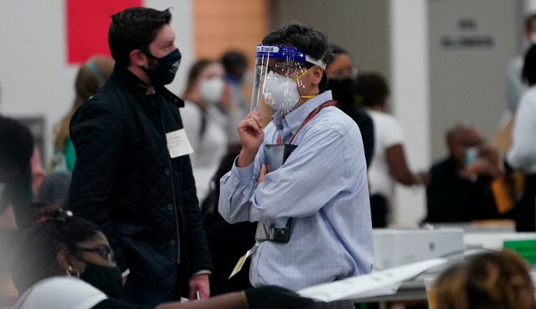 States and cities feeling the latest COVID-19 surge enact new restrictions