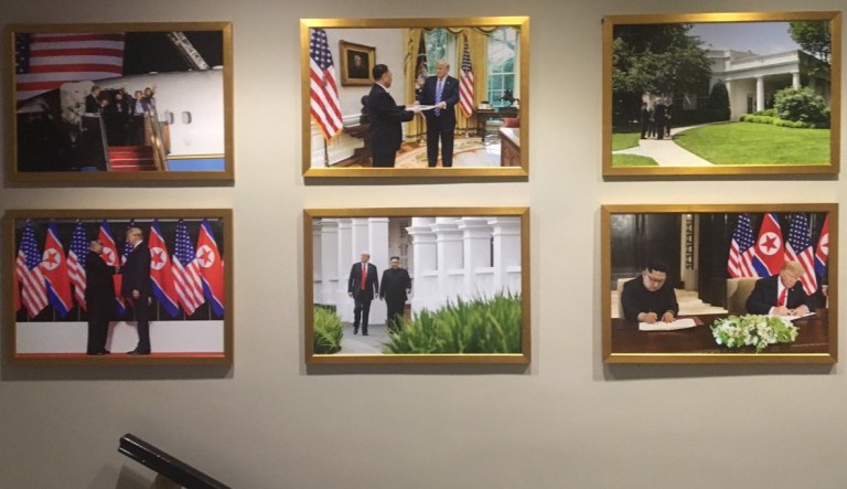 White House puts photos of Trump-Kim summit on display