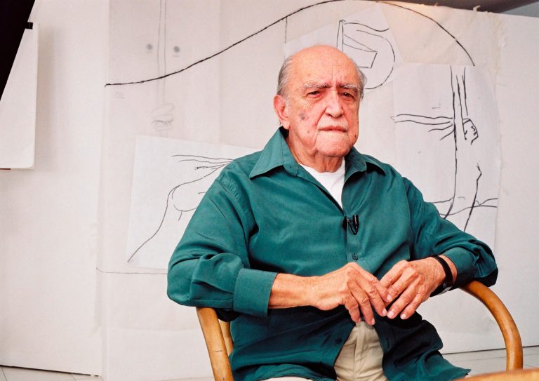   FILE - In this 2002 file photo, Brazilian architect Oscar Niemeyer sits during an interview in his office in Rio de Janeiro, Brazil. According to a hospital spokeswoman on Wednesday, Dec. 5, 2012, famed Brazilian architect Oscar Niemeyer has died at age 104. (AP Photo/Andre Luiz Mello, File)  