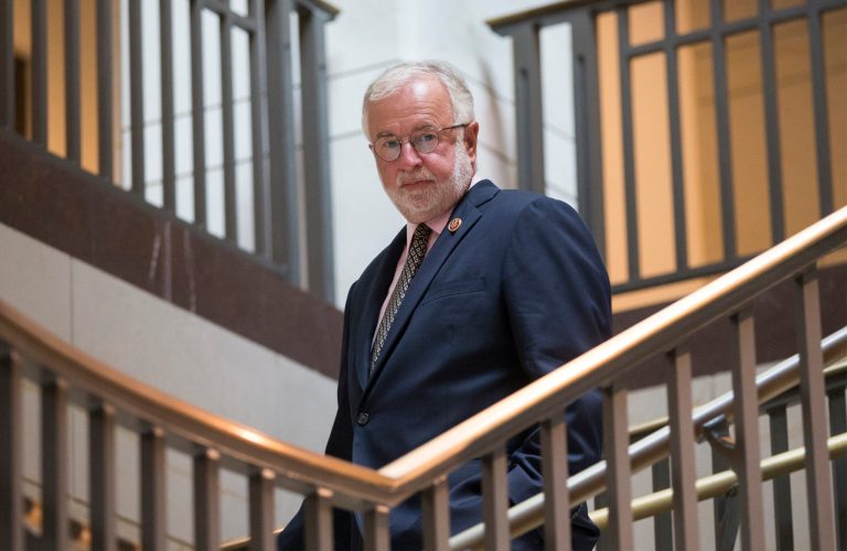 FILE - In this Sept. 11, 2013, file photo, Rep. Tim Bishop, D-N.Y., walks to a national security briefing on the situation in Syria, on Capitol Hill in Washington. Republicans are throwing everything at Bishop in a GOP-leaning New York district at the east end of Long Island, including big-name surrogates, millions in attack ads and a determined effort to make the House race about national issues. (AP Photo/J. Scott Applewhite, File)