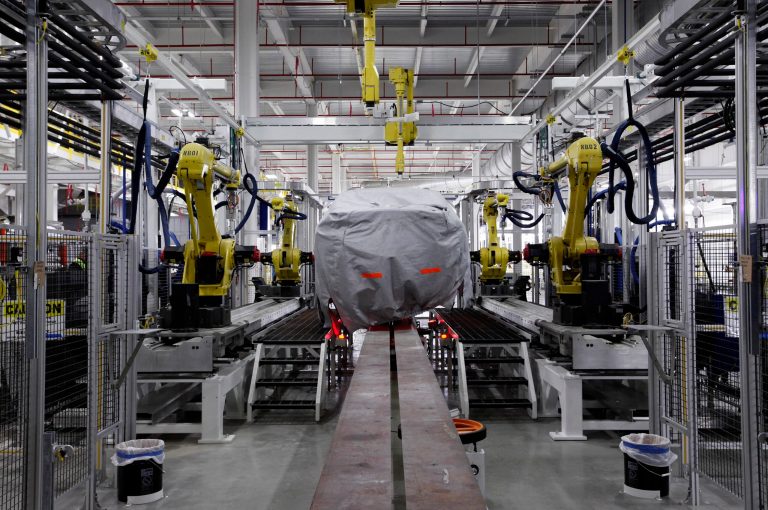 FILE- In thisTuesday, July 16, 2013, file photo, a covered vehicle sits in part of the new paint shop at Chrysler's Sterling Heights Assembly Plant in Sterling Heights, Mich. The Commerce Department issues its second of three estimates of how fast the U.S. economy grew in the July-September quarter of 2013 on Thursday, Dec. 5, 2013. Analyst forecast that third-quarter growth will be revised to a 3.1 percent annual rate, faster than the initial estimate of 2.8 percent. (AP Photo/Paul Sancya, File)