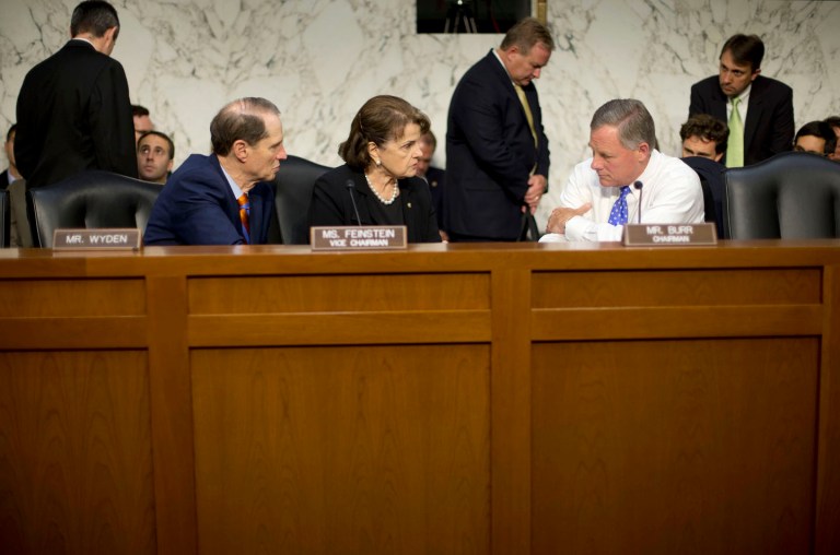 Senate Intelligence Committee Chairman Sen. Richard Burr, R-N.C., right, confers with Sen. Dianne Feinstein, D-Calif., center, and Sen. Ron Wyden, D-Ore., onÂ Sept. 24 before questioning Director of the National Security Agency Adm. Michael Rogers. (AP Photo)