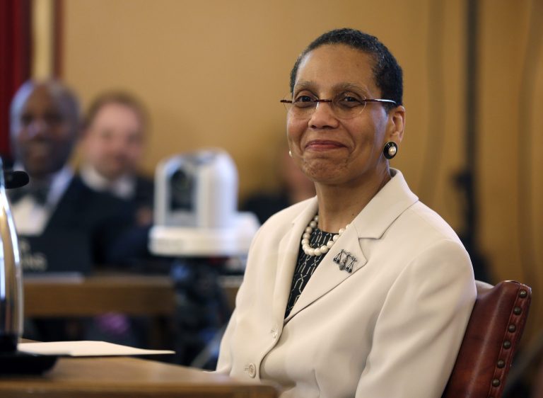 Justice Sheila Abdus-Salaam looks on as members of the state Senate Judiciary Committee vote unanimously to advance her nomination to fill a vacancy on the Court of Appeals at the Capitol on Tuesday, April 30, 2013, in Albany, N.Y. If confirmed by the full Senate, she will be the first African-American woman on the seven-member Court of Appeals. (AP Photo/Mike Groll)