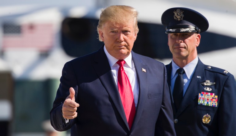 President Donald Trump gives thumbs up as walks to Air Force One as he departs Tuesday, July 30, 2019, at Andrews Air Force Base, Md.