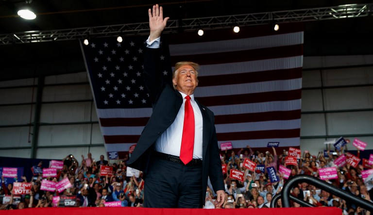President Donald Trump arrives to speak at a campaign rally, Sunday, Nov. 4, 2018, in Macon, Ga.
