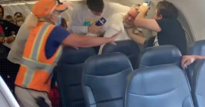 Two men brawl on plane over one man wearing a face shield with no mask
