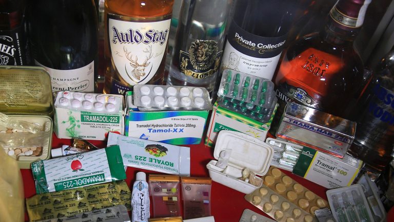 In this Monday, Feb. 11, 2019 photo, confiscated drugs and alcohol are stored inside the anti-drug department at the main police headquarters in Gaza City. An opioid crisis has quietly spread in the Gaza Strip, trapping thousands of people in the hell of addiction and adding another layer of misery to the blockaded and impoverished coastal territory. 