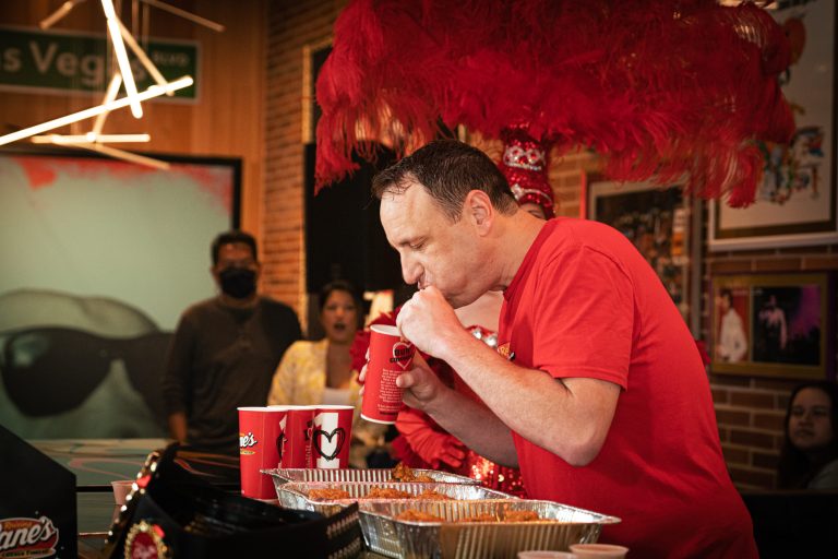 Joey Chestnut, world renowned competitive eater, swapped hot dogs for Raising Caneâs Chicken Fingers and became the new record holder for chicken finger eating, July 27, 2022.