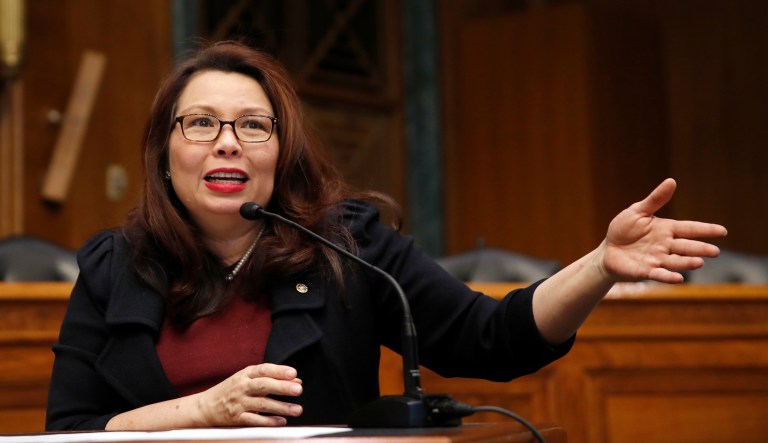 In this Feb. 14, 2018, photo, Sen. Tammy Duckworth, D-Ill., speaks to Goldman Sachs 10,000 Small Businesses Summit, on Capitol Hill, in Washington. Duckworth doesn't blend in, and that's the way she likes it. The decorated Iraqi War veteran who lost both legs when her helicopter was shot down is an Asian-American woman in the mostly-white, mostly-male and very fusty Senate. And now, with a baby due in April, the Illinois Democrat will be the first senator to give birth while in office.