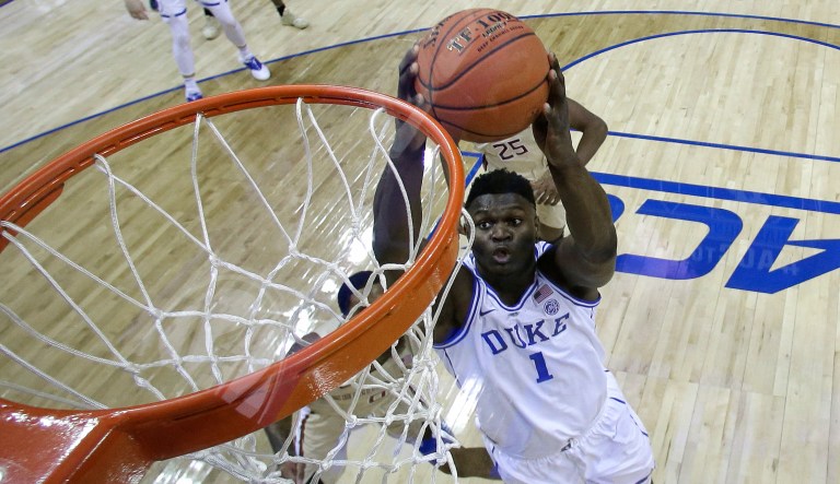 Duke's Zion Williamson (1) goes up to dunk against Florida State during the first half of the NCAA college basketball championship game of the Atlantic Coast Conference tournament in Charlotte, N.C., Saturday, March 16, 2019.