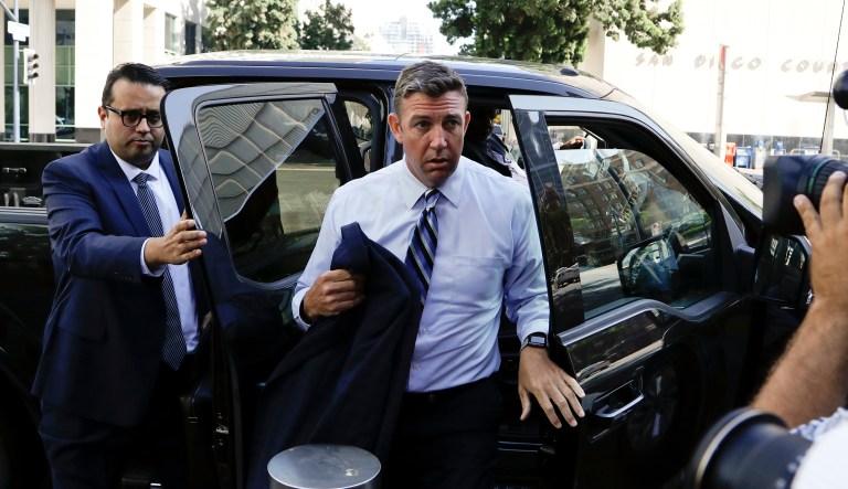 U.S. Rep. Duncan Hunter, center, arrives for an arraignment hearing Thursday, Aug. 23, 2018, in San Diego. Hunter and his wife were indicted Tuesday on federal charges that they used more than $250,000 in campaign funds for personal expenses that ranged from groceries to golf trips and lied about it in federal filings, prosecutors said.