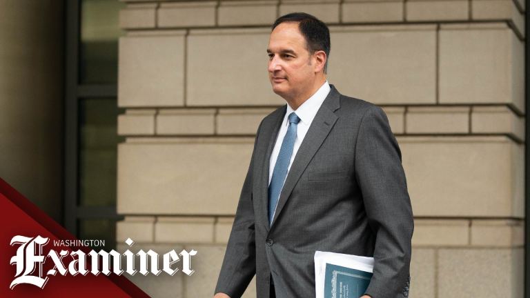 Michael Sussmann pictured walking into courthouse at start of Durham trial 