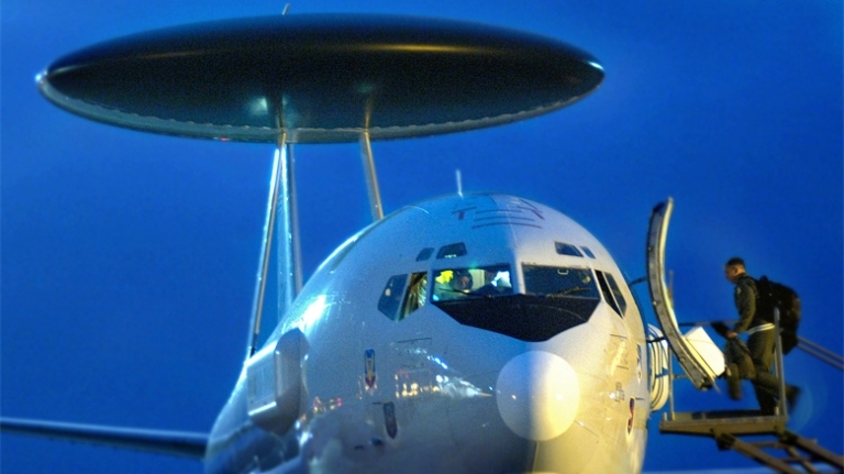An E-3 Sentry airborne warning and control system, or AWACS, aircrew member boards the surveillance aircraft at the former Forward Operating Location Manta in Ecuador before a mission to search for illegal drug runners over the eastern Pacific Ocean Aug. 1, 2007. 