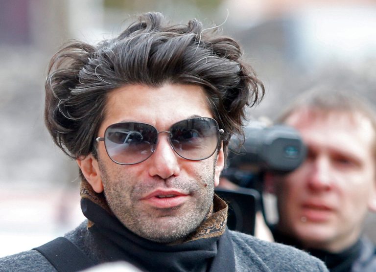 FILE - In this Friday, April 12, 2013 file photo Bolshoi principal dancer Nikolai Tsiskaridze walks to a court to take part in the first hearing of a civil lawsuit he is bringing against the Bolshoi theater's general director as part of an effort to unseat him, in Moscow, Russia. The Bolshoi Theater announced late Saturday, June 8, 2013, that it has fired Nikolai Tsiskaridze, a veteran principal dancer and teacher who for years has been in open conflict with managers at the celebrated Russian theater. (AP Photo/Misha Japaridze, file)